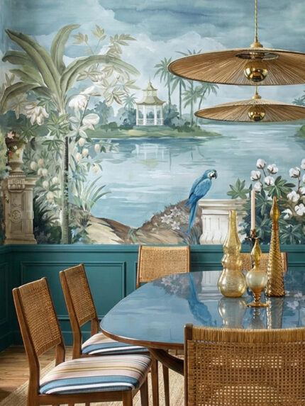 Scenic tropical wall mural by Musee featuring a blue macaw, stone balustrade, lush palm trees, and a distant gazebo on a lake, luxury wallpaper Dubai.