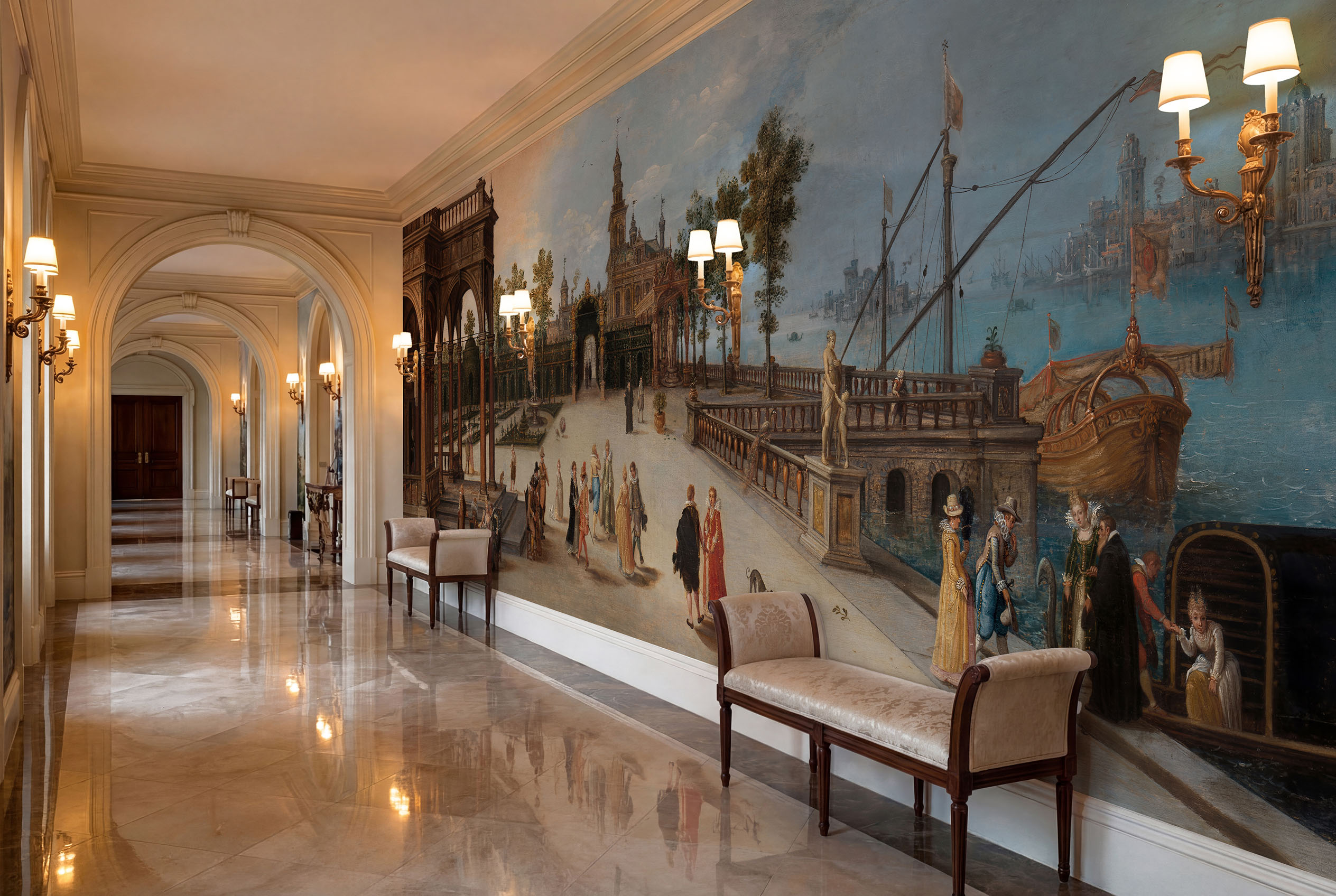 Musee | Venetian Soiree Wall Mural Musee custom wall mural featuring a digitally restored historical classical painting of an elegant dancing party in a Renaissance palace forecourt with a Capriccio view of Venice.