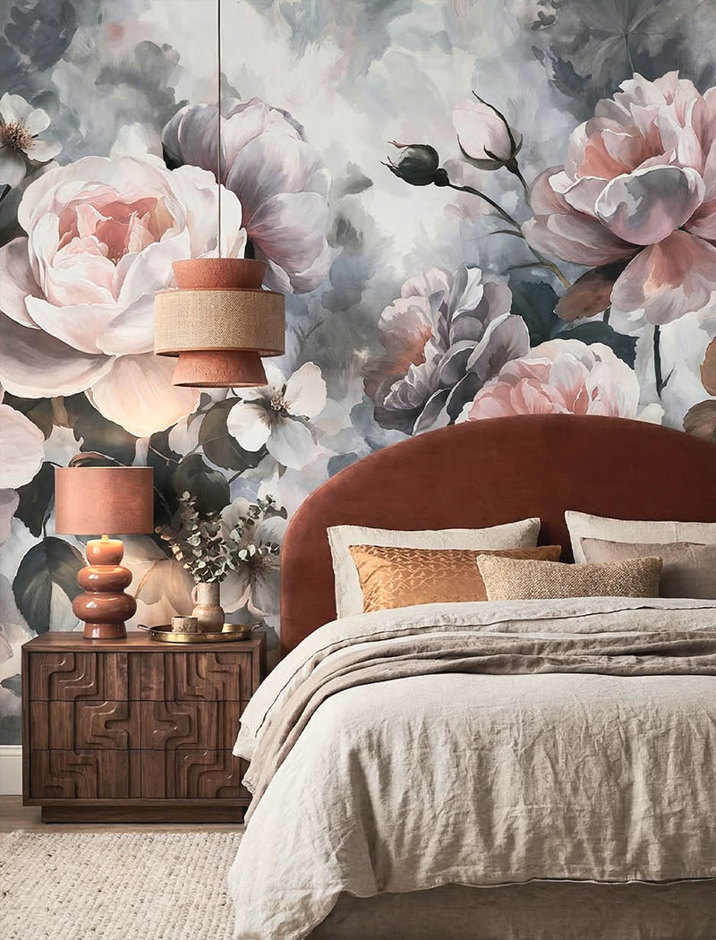 Large scale soft pink and grey watercolor floral custom wallpaper mural behind a luxury bed. "Petal Reverie" romantic bedroom wallpaper in Dubai.