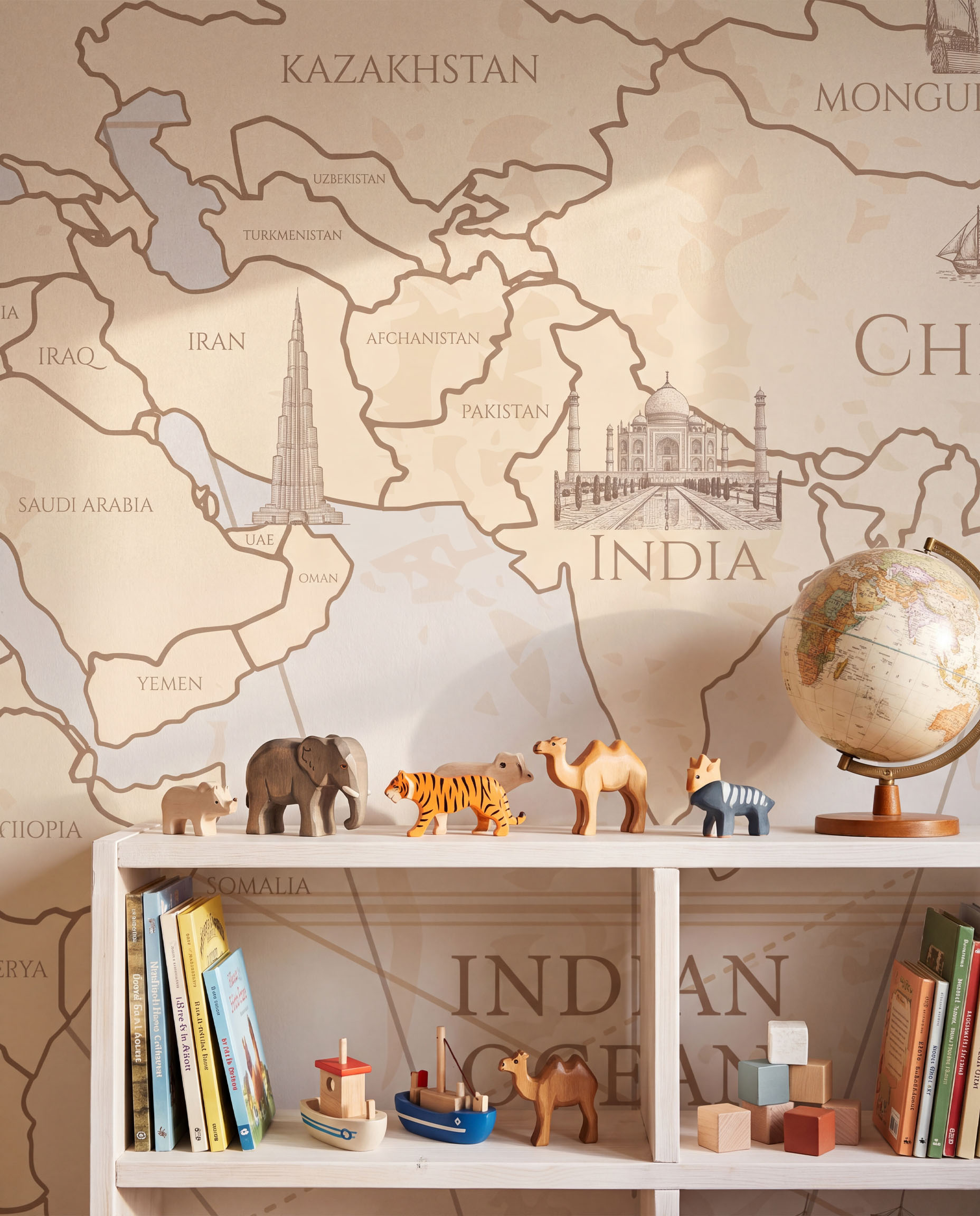 Interior room mockup featuring the Musee Navigator's Atlas wall mural with a vintage sketched world map, creating an elegant and educational kids room atmosphere.5 Interior room mockup featuring the Musee Navigator's Atlas wall mural with a vintage sketched world map, creating an elegant and educational kids room atmosphere.5