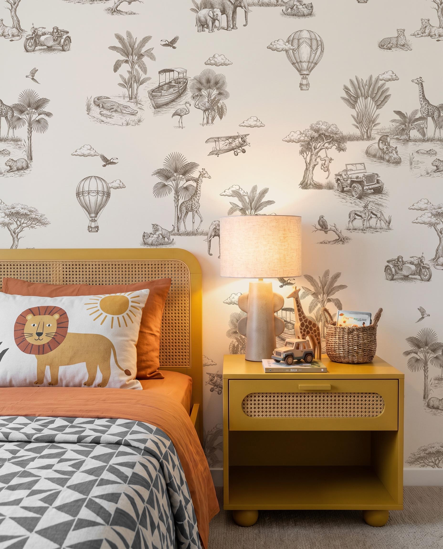 Interior room mockup featuring the Musee Savannah Voyage wall mural with a vintage sketched safari pattern, creating an elegant and adventurous kids room atmosphere.1 Interior room mockup featuring the Musee Savannah Voyage wall mural with a vintage sketched safari pattern, creating an elegant and adventurous kids room atmosphere.1